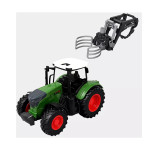 Traktor s priključkom - prijemalka za bale